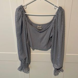 Urban Outfitters light blue long sleeved flowy crop top blouse